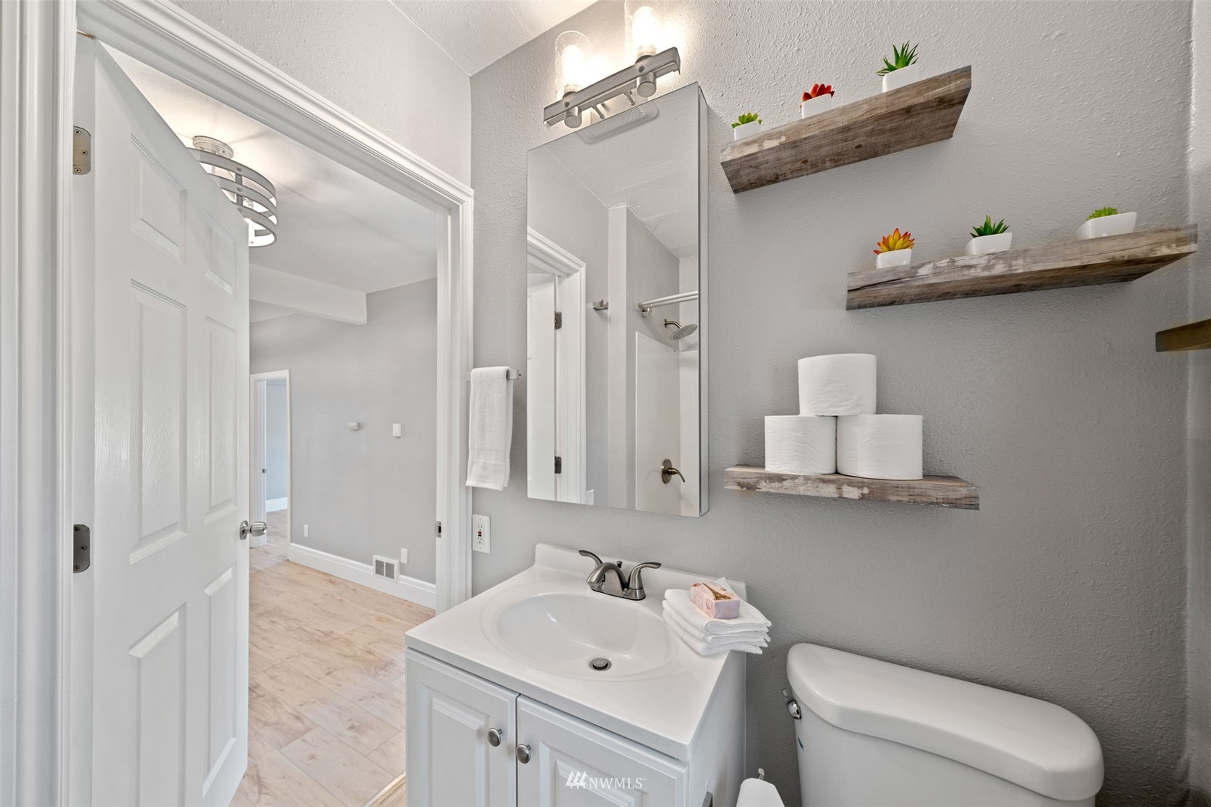 16442 111th Avenue Southeast Renton, WA 98055 - Photo 33 of 40 a bathroom with a sink mirror and toilet