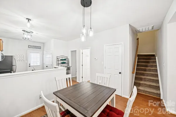 a kitchen with sink cabinets and wooden floor