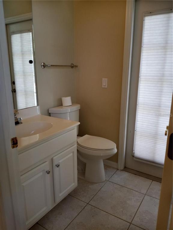 6506 Waters Edge Way Lakewood Ranch, FL 34202 - Photo 12 of 14 a bathroom with a toilet sink and mirror