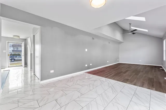 a view of an empty room and window