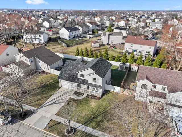 an aerial view of residential houses with outdoor space
