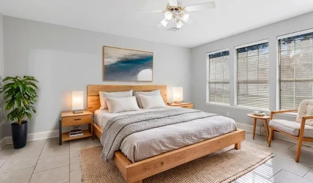 a bedroom with bed and balcony