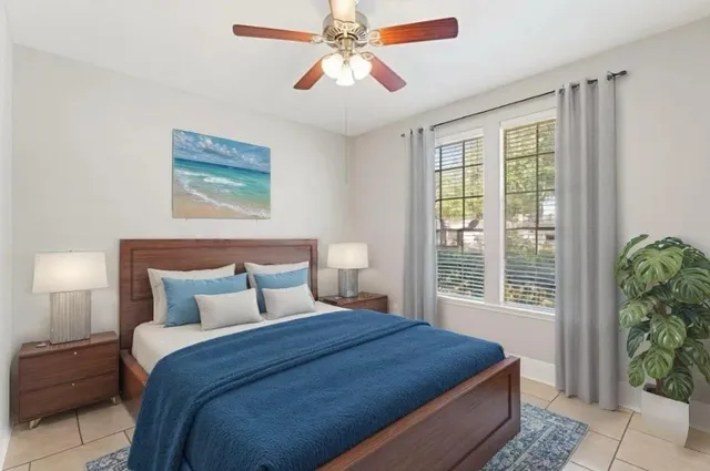 a bedroom with a large bed and a window