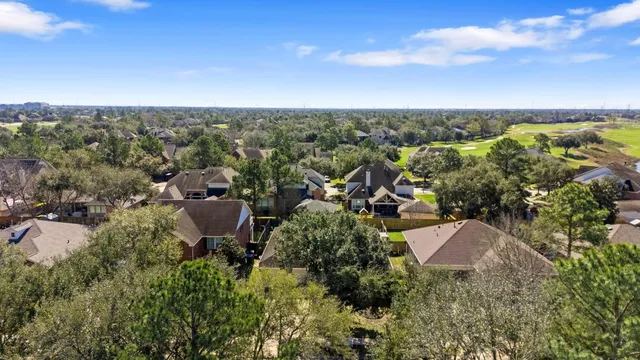 an aerial view of a house with lots of trees