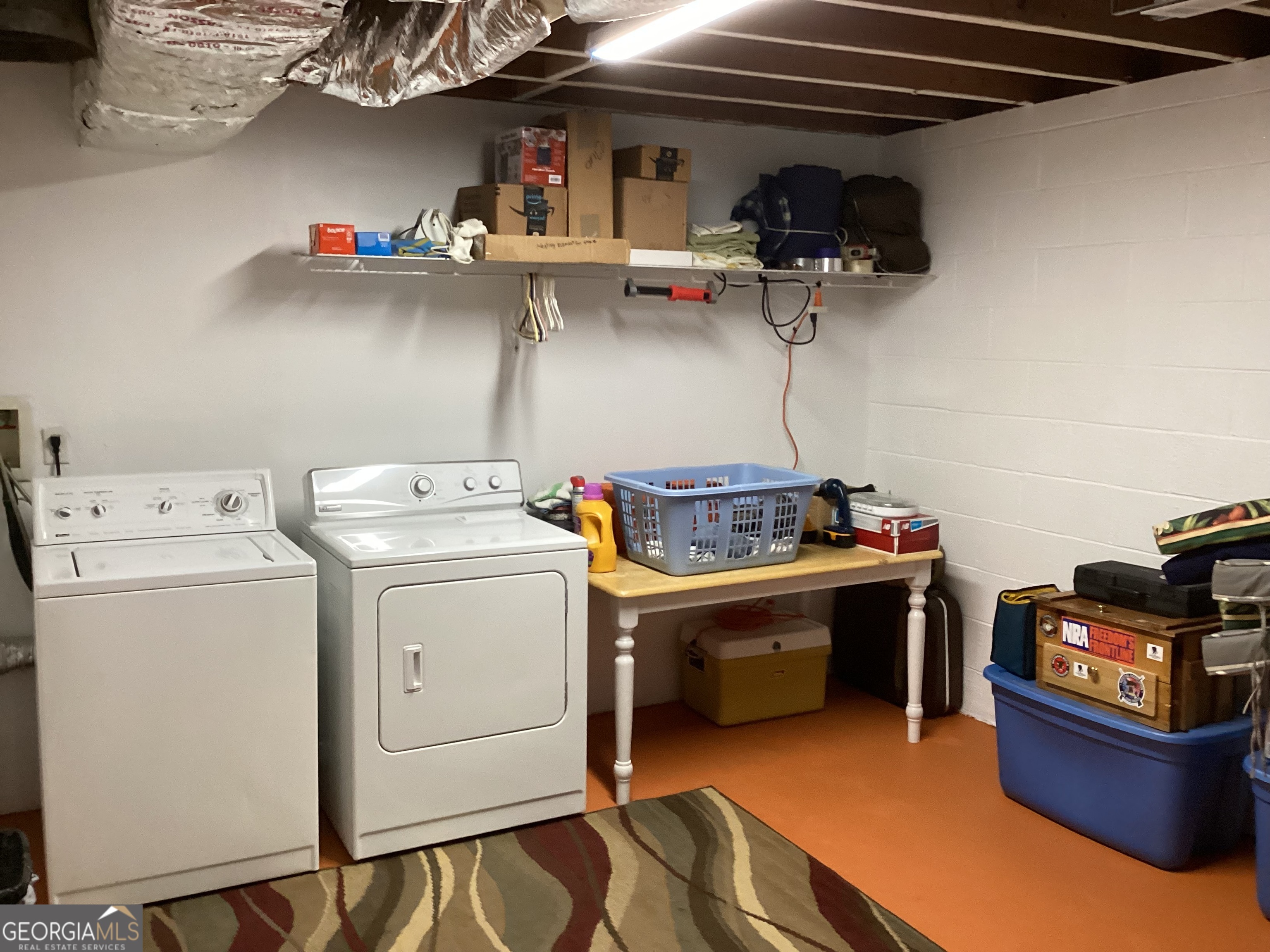 2779 Bob Cox Road Marietta, GA 30064 - Photo 48 of 48 a view of storage and utility room with washer and dryer
