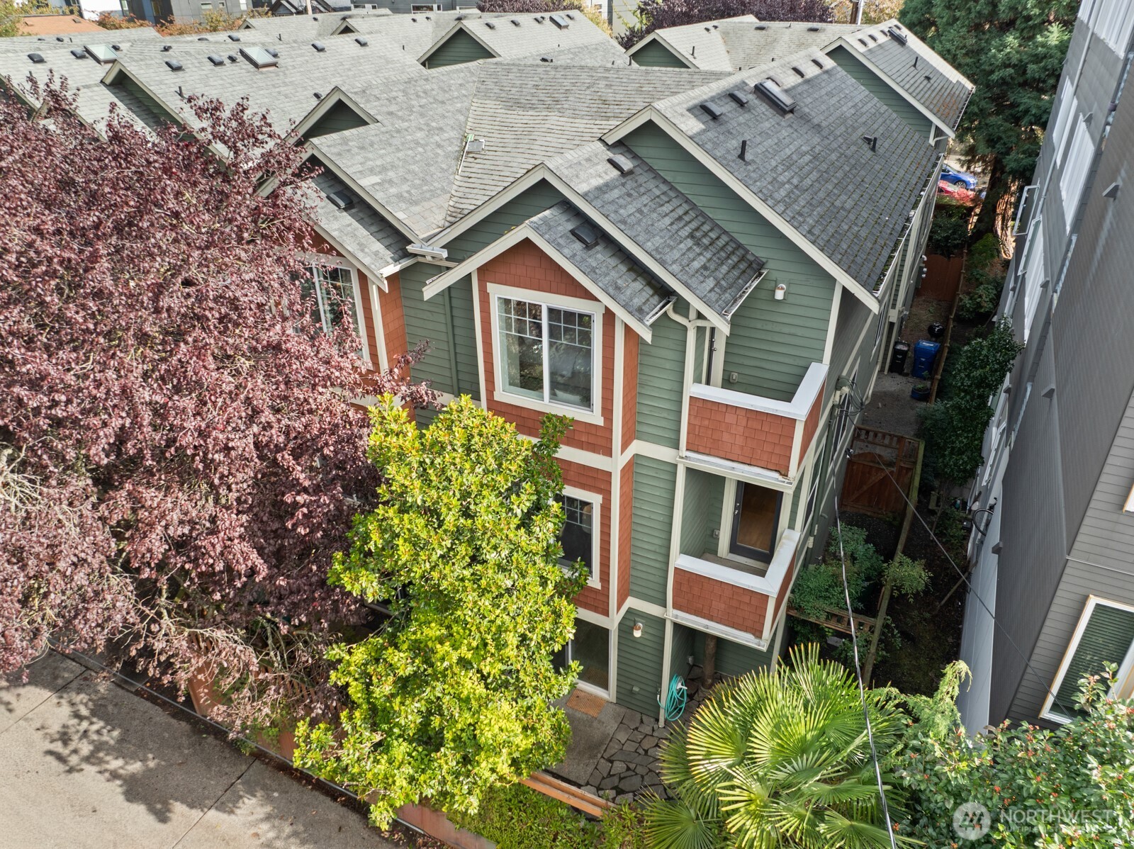 121 21st Avenue East, Unit C Seattle, WA 98112 - Photo 1 of 38 an aerial view of a house with a yard and potted plants