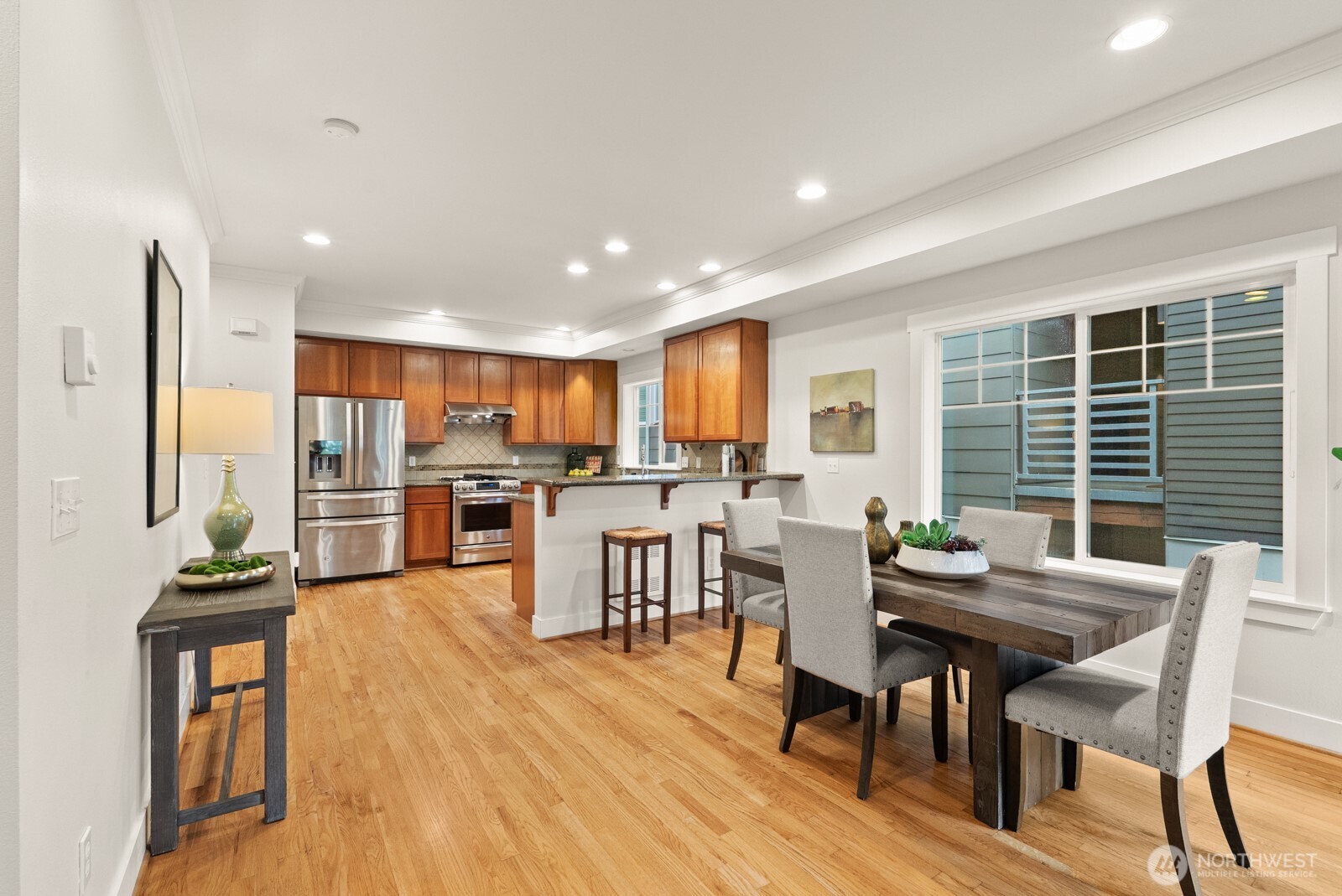 121 21st Avenue East, Unit C Seattle, WA 98112 - Photo 11 of 38 a view of a dining room with furniture window and wooden floor