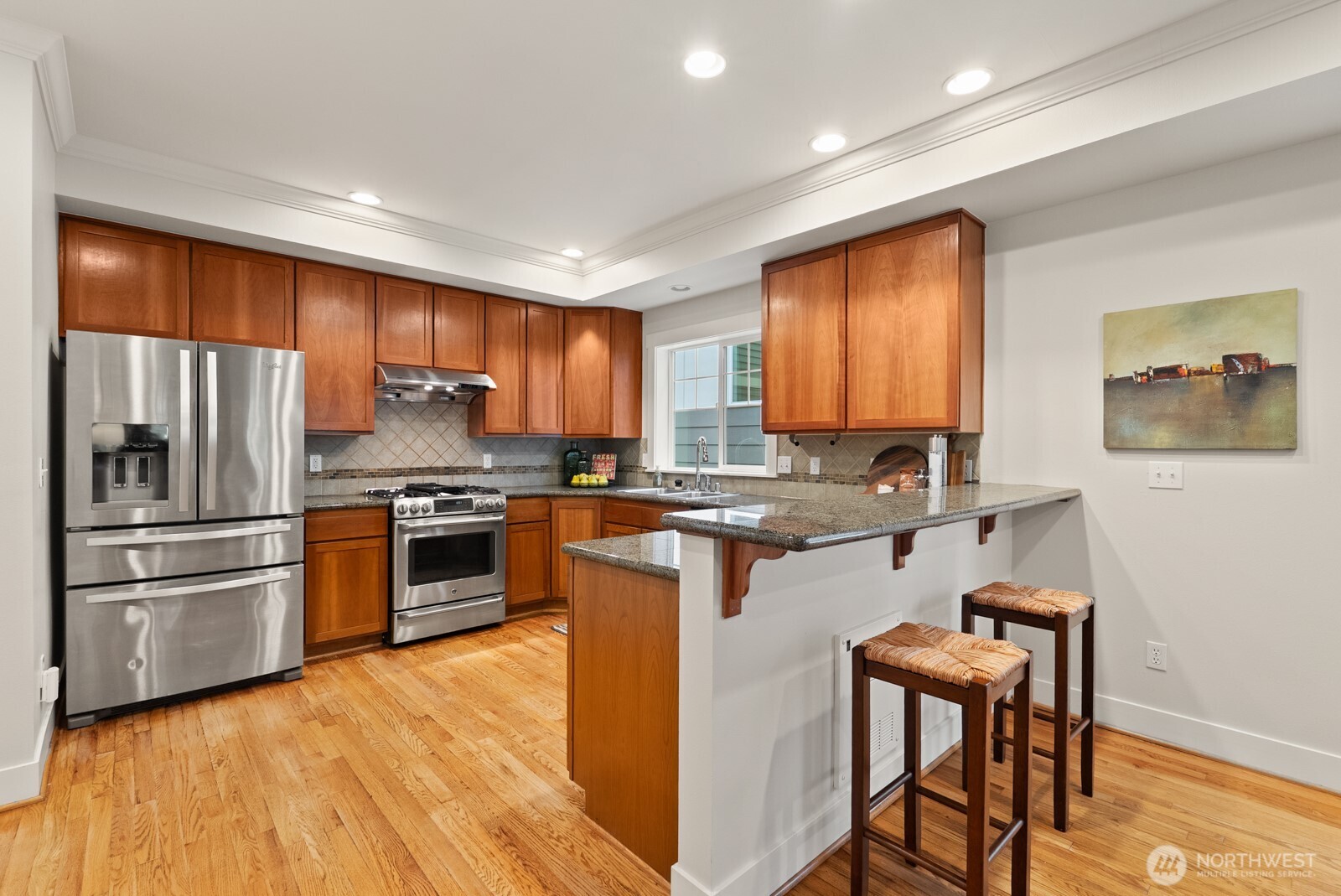 121 21st Avenue East, Unit C Seattle, WA 98112 - Photo 13 of 38 a kitchen with granite countertop a refrigerator stove top oven and sink