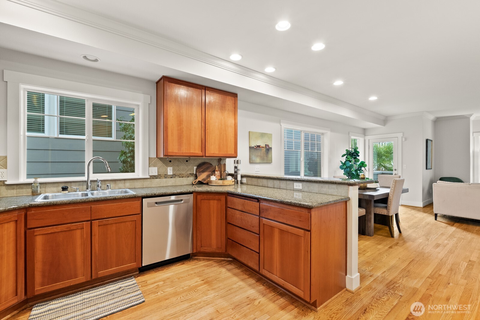 121 21st Avenue East, Unit C Seattle, WA 98112 - Photo 18 of 38 a kitchen with a sink cabinets and wooden floor