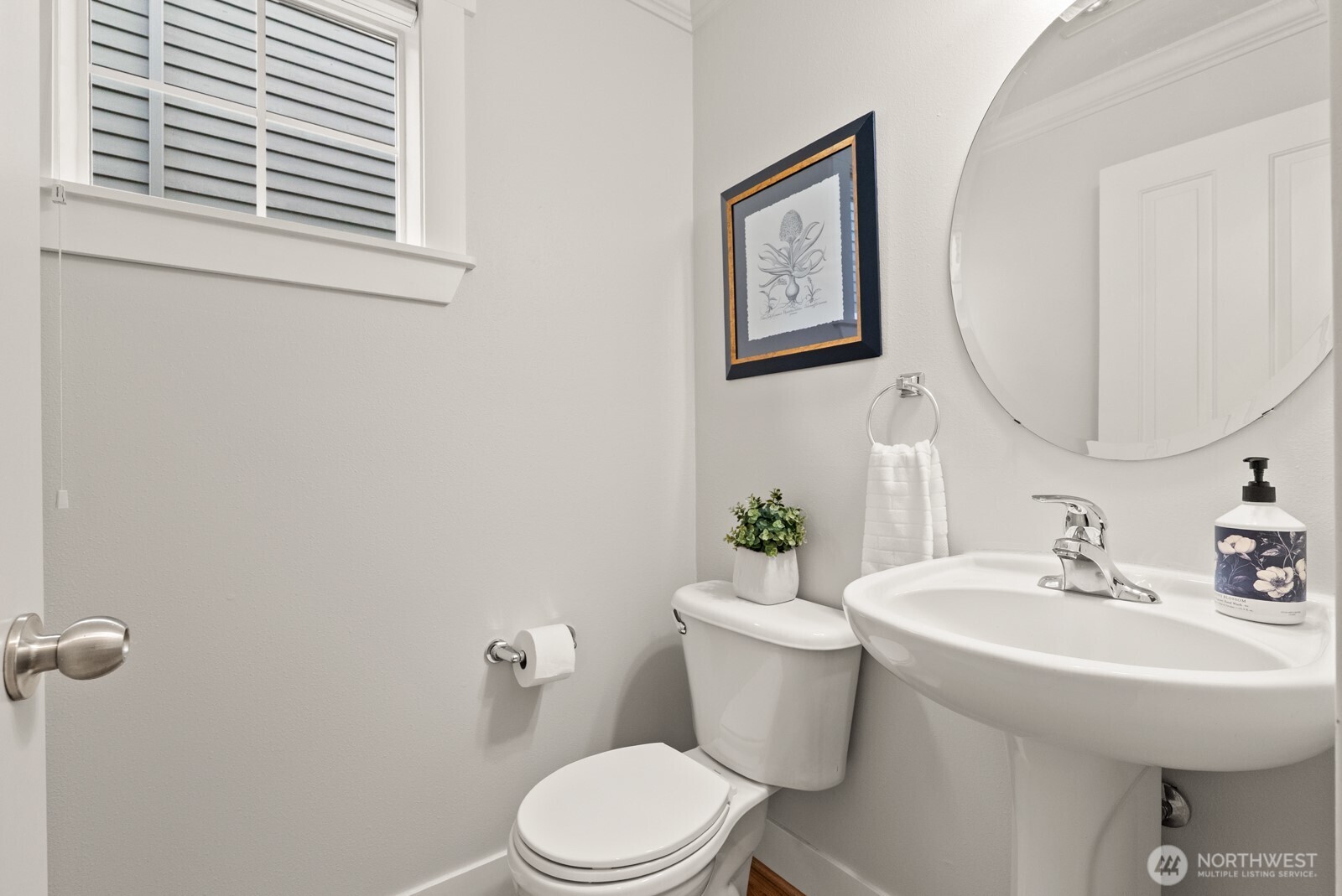 121 21st Avenue East, Unit C Seattle, WA 98112 - Photo 19 of 38 a bathroom with a toilet a sink and mirror
