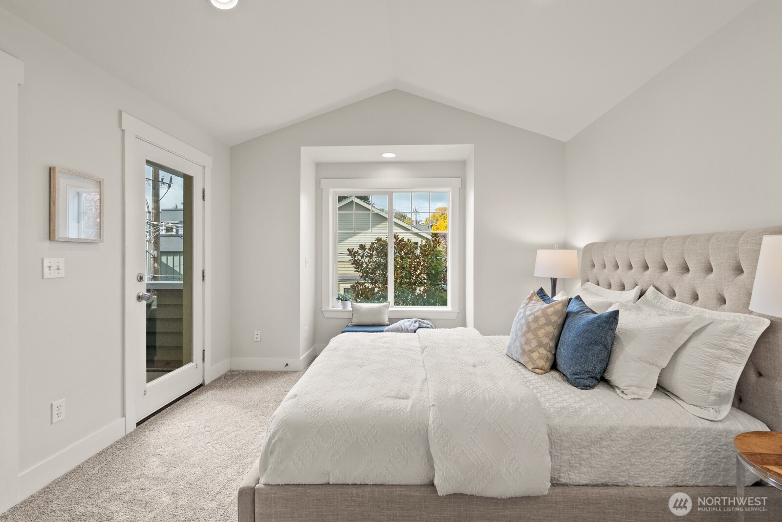 121 21st Avenue East, Unit C Seattle, WA 98112 - Photo 20 of 38 a bedroom with a bed and a window