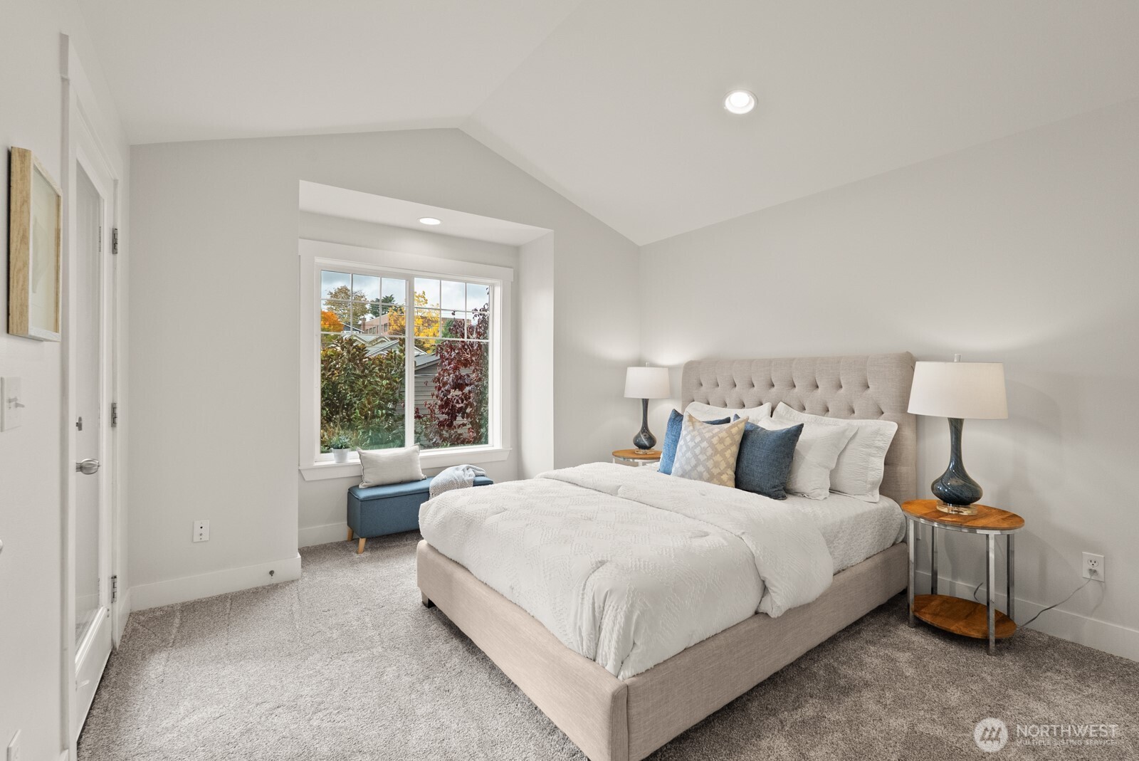 121 21st Avenue East, Unit C Seattle, WA 98112 - Photo 21 of 38 a bedroom with a bed and a window