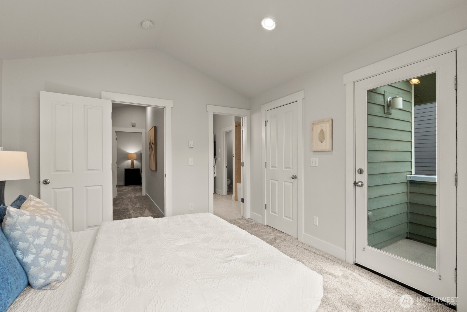 121 21st Avenue East, Unit C Seattle, WA 98112 - Photo 23 of 38 a bedroom with a bed and a mirror