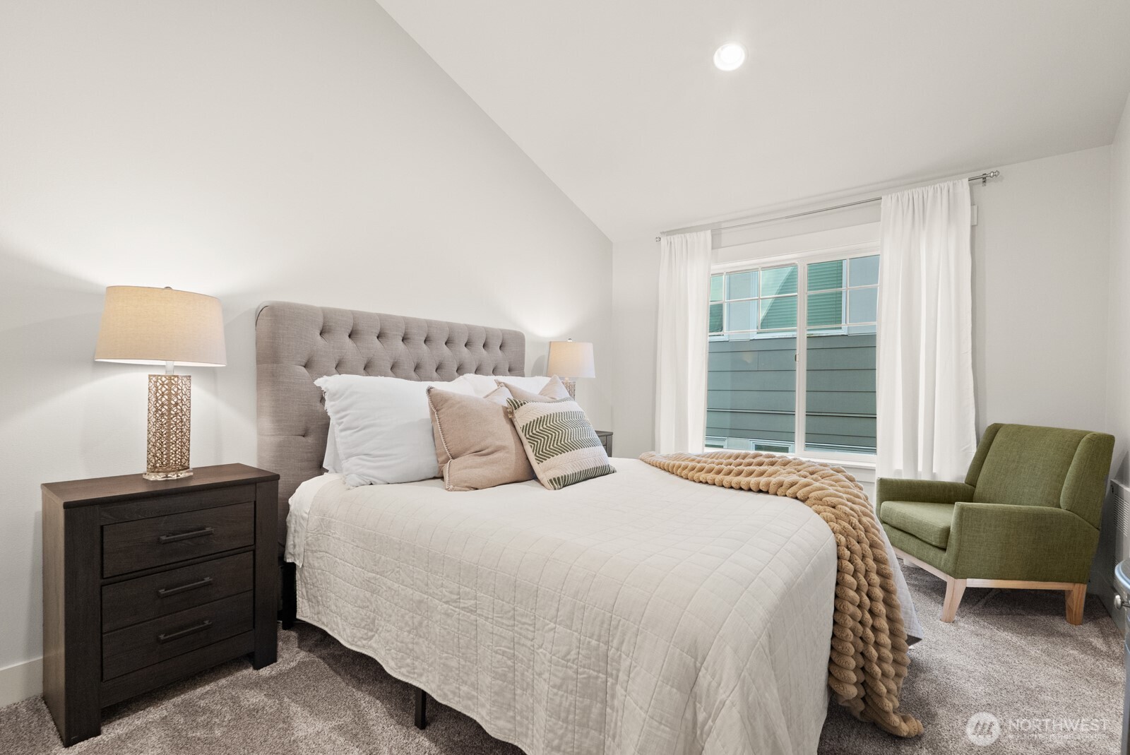 121 21st Avenue East, Unit C Seattle, WA 98112 - Photo 30 of 38 a bedroom with a bed and a couch