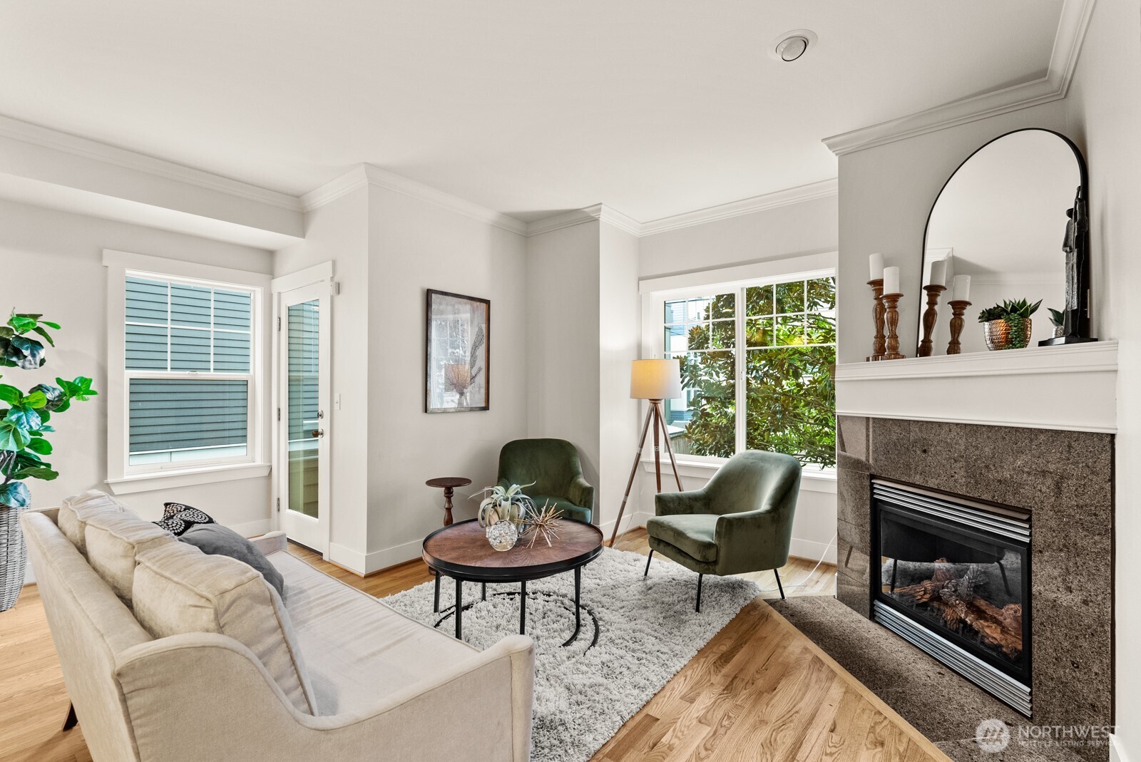 121 21st Avenue East, Unit C Seattle, WA 98112 - Photo 9 of 38 a living room with furniture and a fireplace
