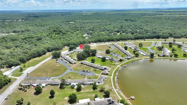 an aerial view of a house with outdoor space