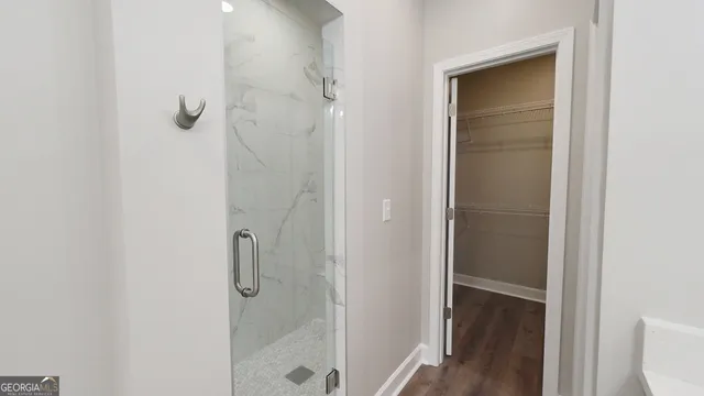 a bathroom with a glass shower door