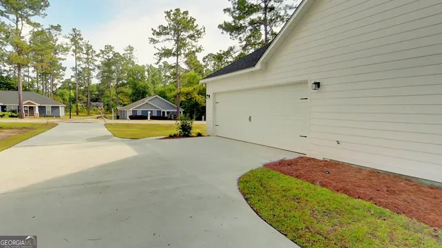a view of an house with backyard space and swimming pool