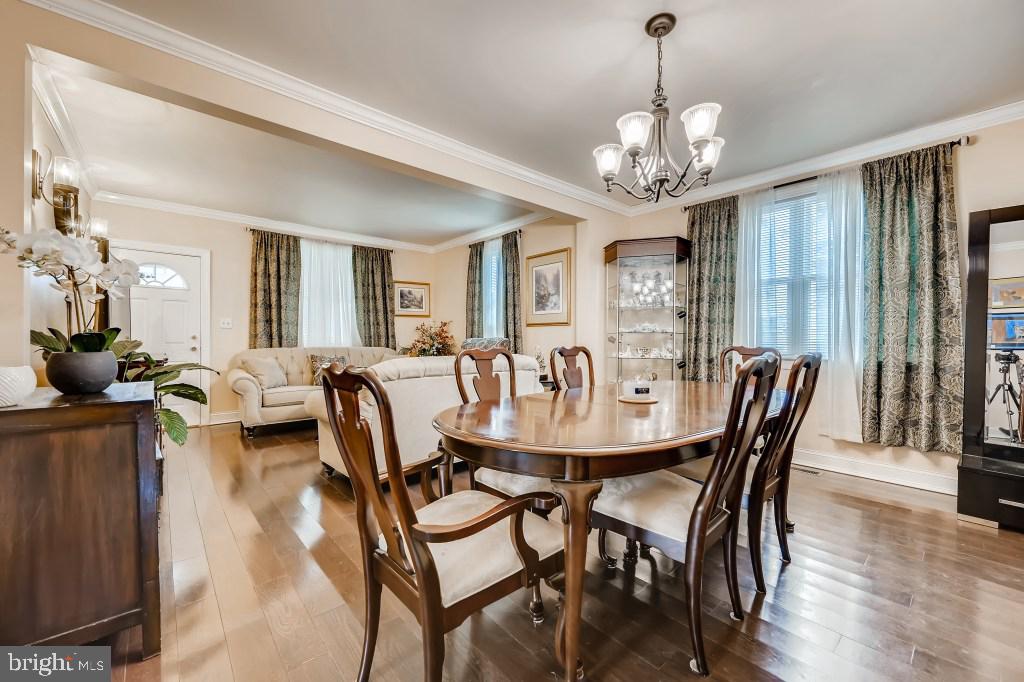 9422 Cross Road Nottingham, MD 21236 - Photo 11 of 31 a view of a dining room with furniture window and wooden floor