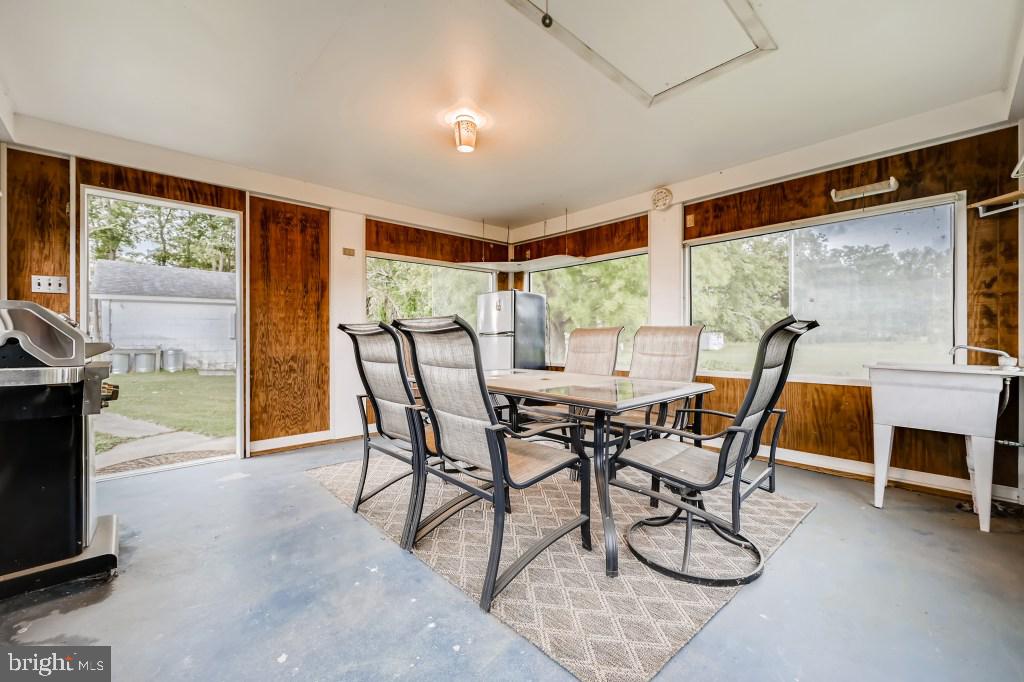 9422 Cross Road Nottingham, MD 21236 - Photo 26 of 31 a view of a dining room with furniture window and outside view