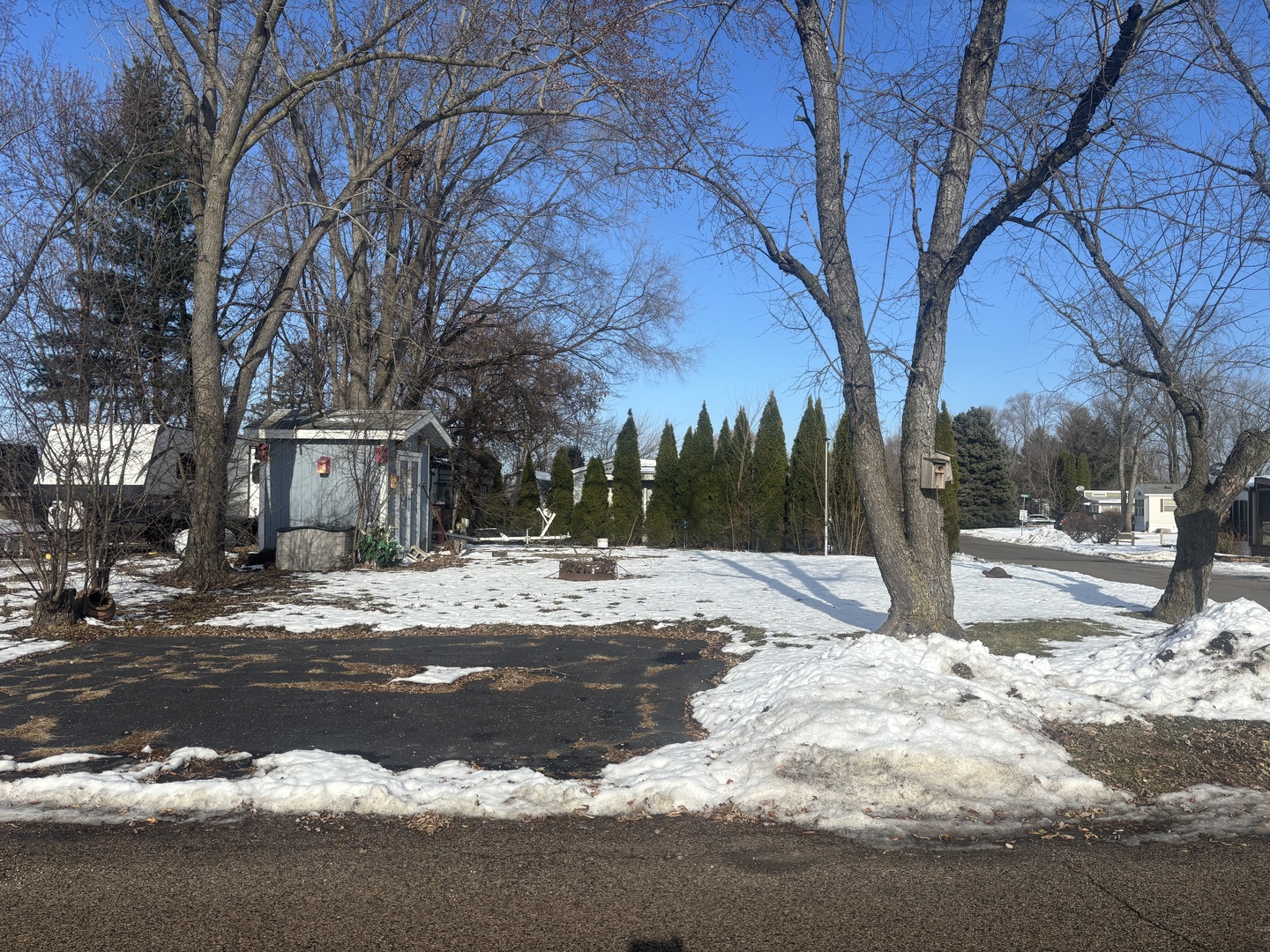 191 Drydock Road Lakemoor, IL 60051 - Photo 1 of 5 a view of road with snow on both side