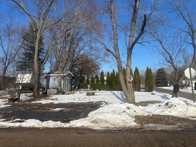 a view of a yard covered with snow