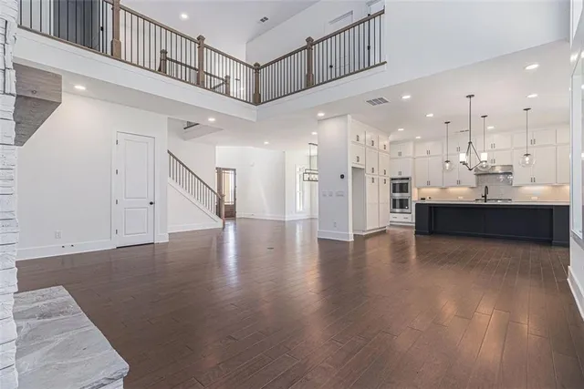 a view of a kitchen with a sink and cabinets