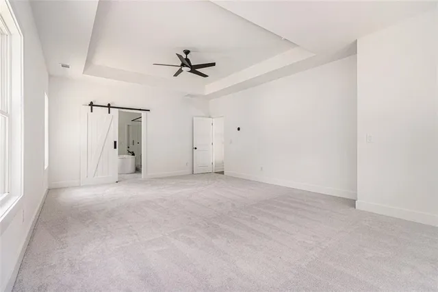 a view of empty room with ceiling fan