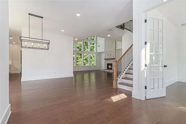 a view of entryway and hall with wooden floor