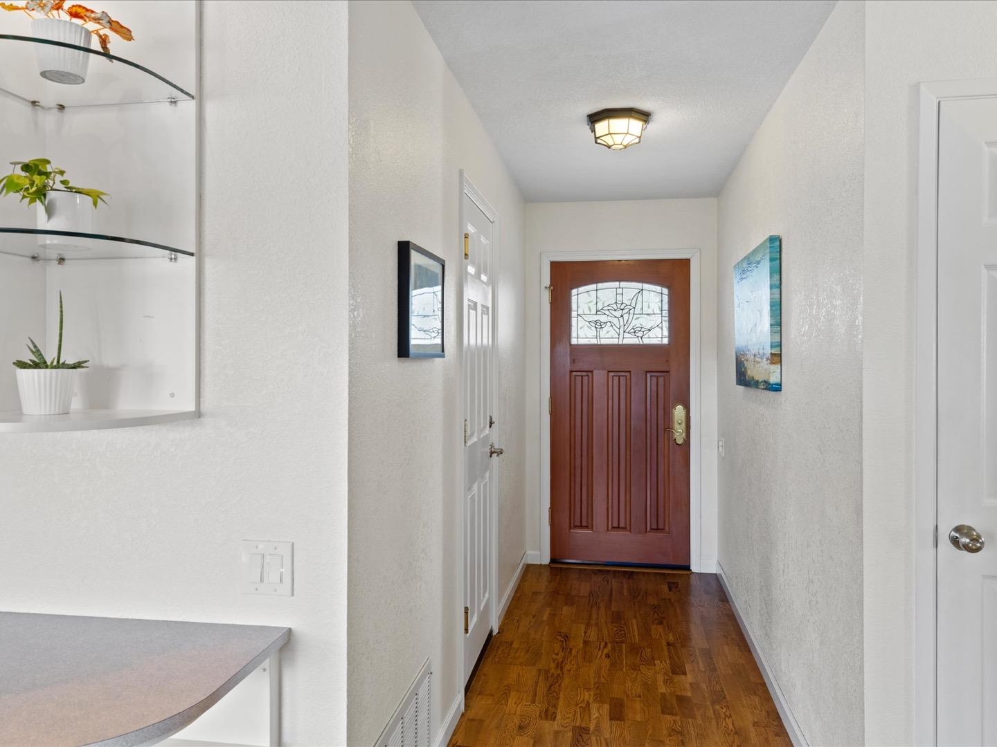 617 Lewis Road San Jose, CA 95111 - Photo 12 of 31 a view of a hallway with wooden floor and closet