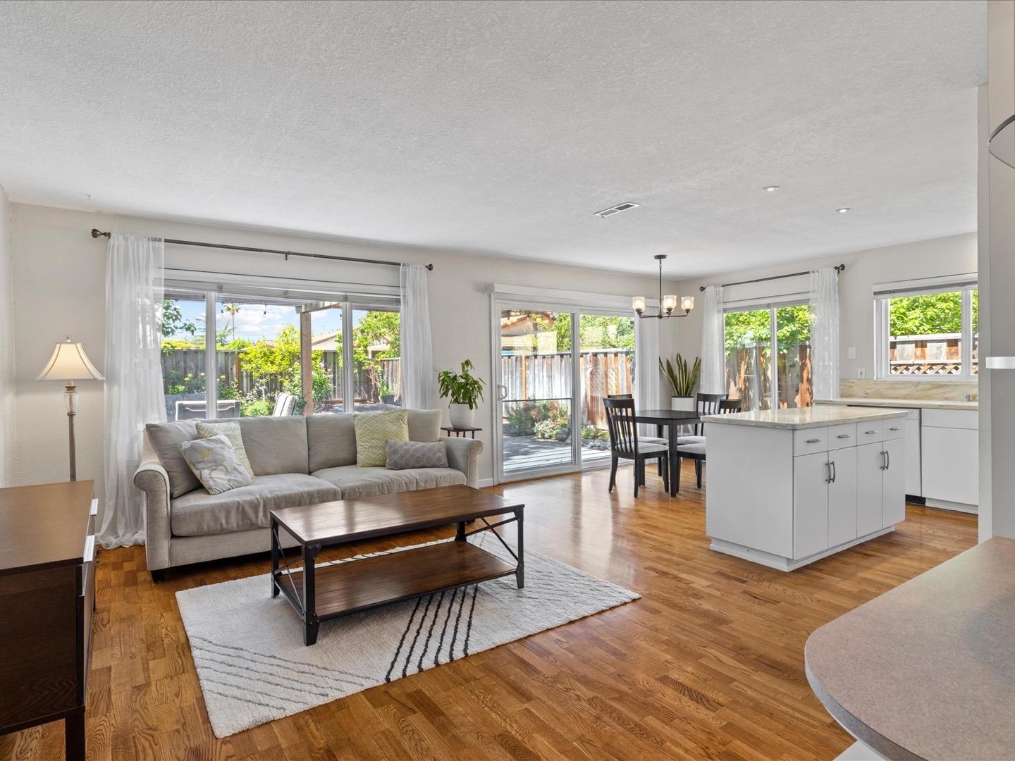 617 Lewis Road San Jose, CA 95111 - Photo 13 of 31 a living room with furniture and a wooden floor