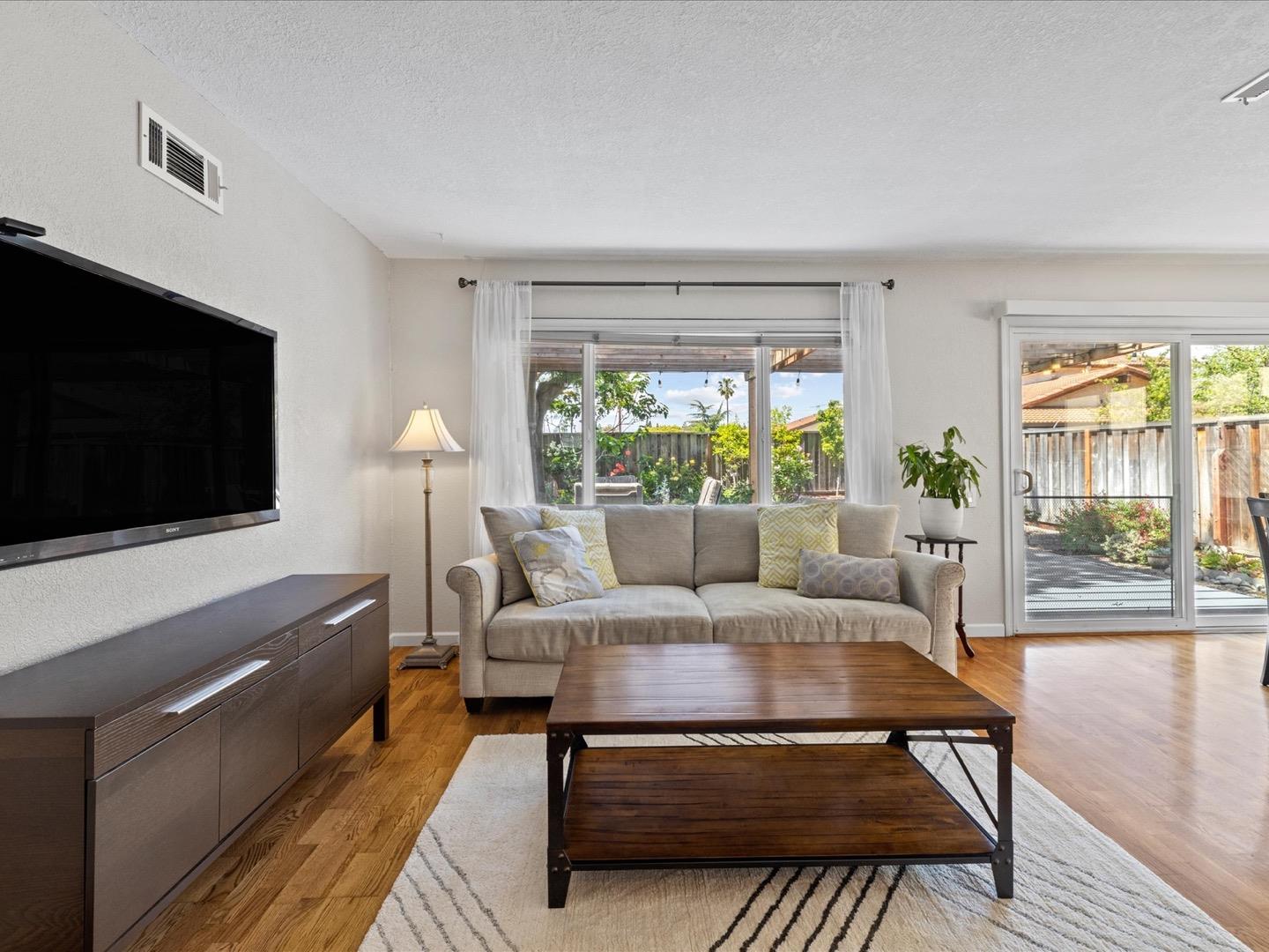 617 Lewis Road San Jose, CA 95111 - Photo 14 of 31 a living room with furniture and a flat screen tv