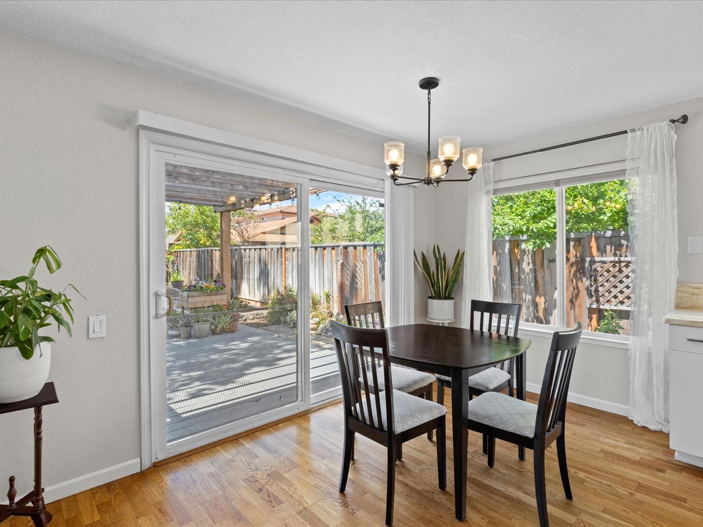 617 Lewis Road San Jose, CA 95111 - Photo 19 of 31 a dining room with furniture window and wooden floor