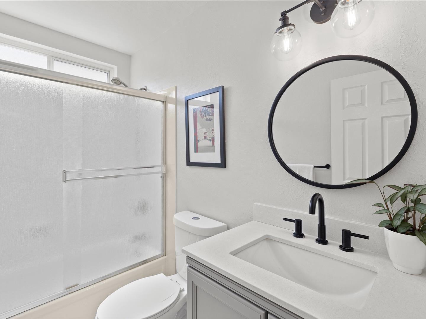 617 Lewis Road San Jose, CA 95111 - Photo 23 of 31 a bathroom with a sink toilet and a mirror