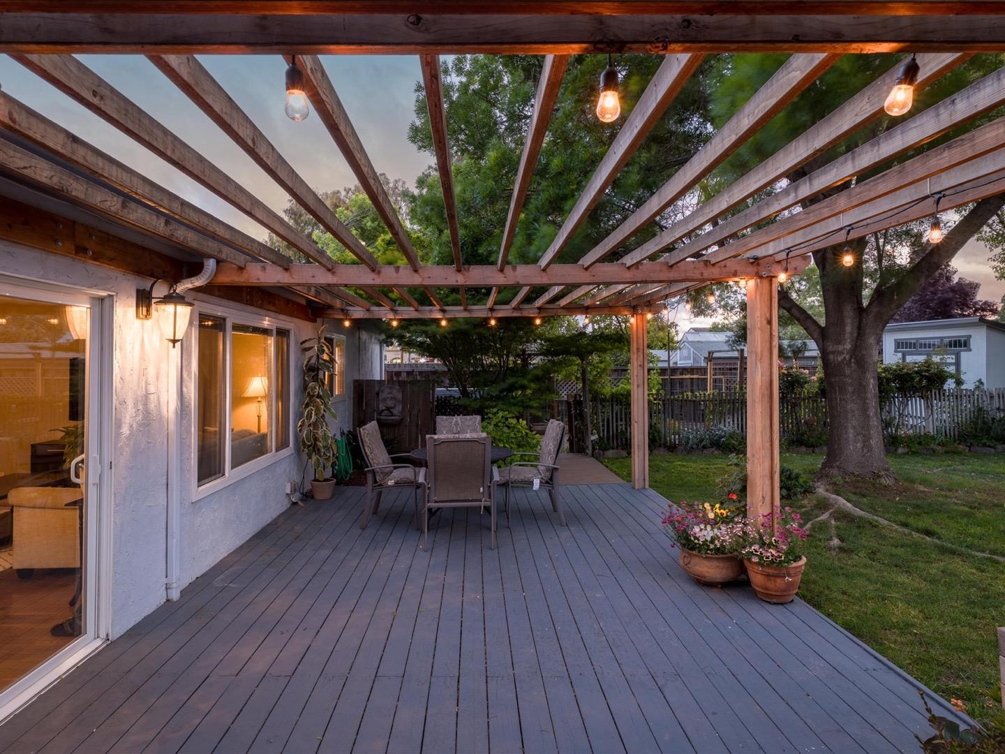 617 Lewis Road San Jose, CA 95111 - Photo 7 of 31 a view of a patio with table and chairs potted plants with wooden floor