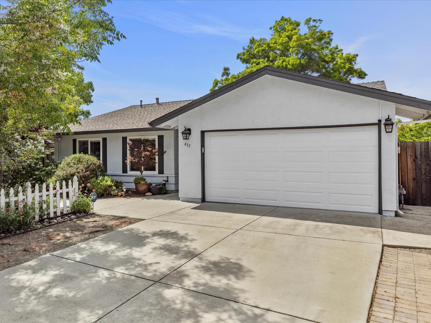 617 Lewis Road San Jose, CA 95111 - Photo 8 of 31 a backyard of a house with potted plants and covered with wooden fence