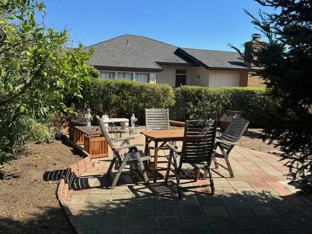 a view of backyard with seating space