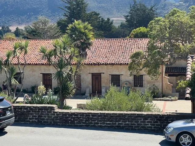 front view of a house with a garden