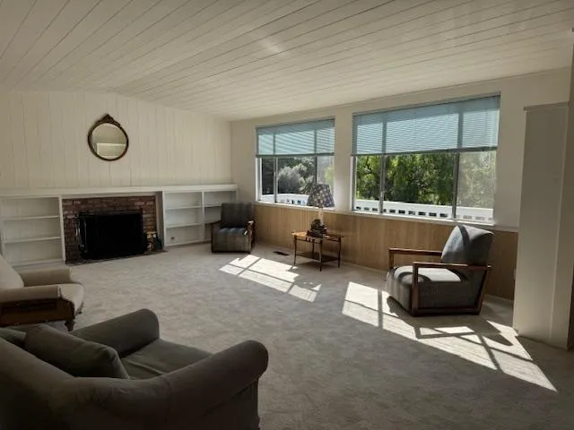 a workspace with furniture and a window