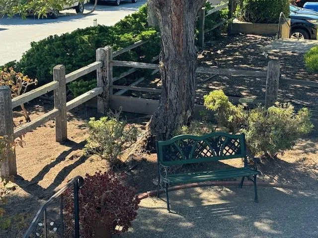 a room with furniture a flat screen tv and a window