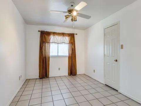 5910 Buffridge Trail Dallas, TX 75252 - Photo 13 of 24 a view of an empty room and window
