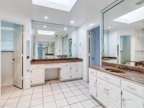 5910 Buffridge Trail Dallas, TX 75252 - Photo 14 of 24 a spacious bathroom with a granite countertop sink mirror and