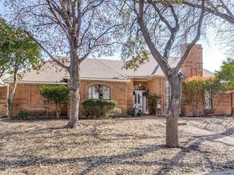 5910 Buffridge Trail Dallas, TX 75252 - Photo 24 of 24 a front view of a house with garden