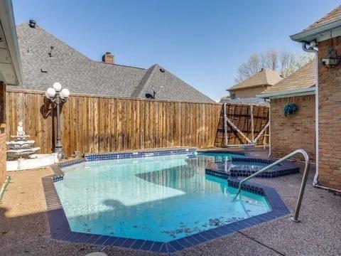 5910 Buffridge Trail Dallas, TX 75252 - Photo 3 of 24 a view of a swimming pool with a patio
