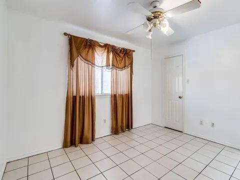 5910 Buffridge Trail Dallas, TX 75252 - Photo 5 of 24 a view of an empty room and window