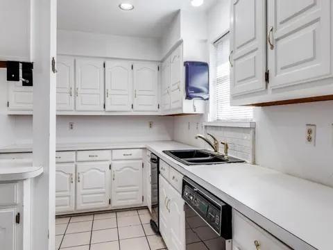 5910 Buffridge Trail Dallas, TX 75252 - Photo 9 of 24 a kitchen with stainless steel appliances granite countertop a sink and a stove