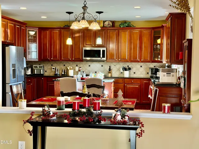 a living room with furniture a table tennis table and a window