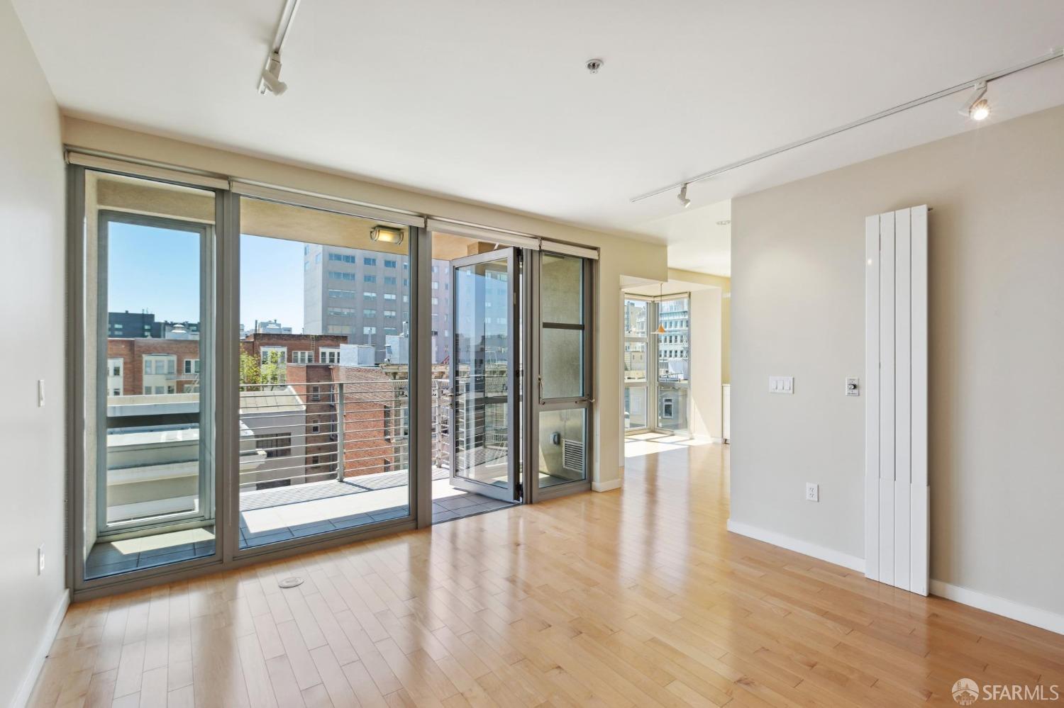 a view of an empty room with glass door