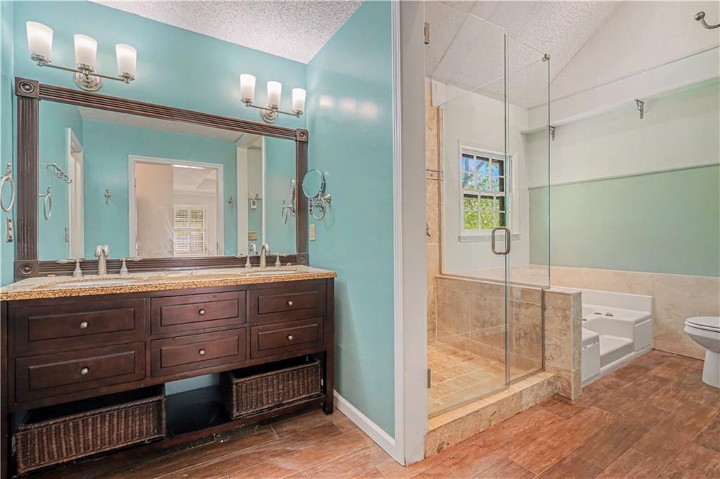 1527 Ridgewood Drive Southwest Lilburn, GA 30047 - Photo 13 of 19 a bathroom with a sink and a mirror