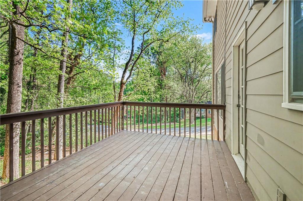1527 Ridgewood Drive Southwest Lilburn, GA 30047 - Photo 4 of 19 a view of a wooden deck